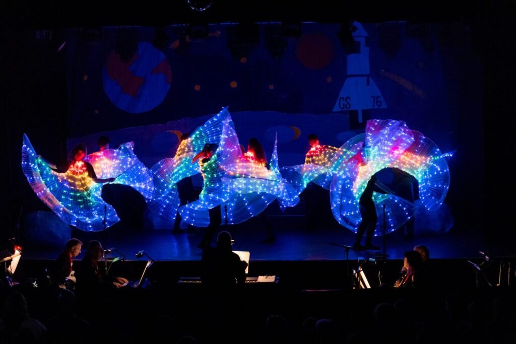 Harpenden Gang Show dancers with light-up LED wings